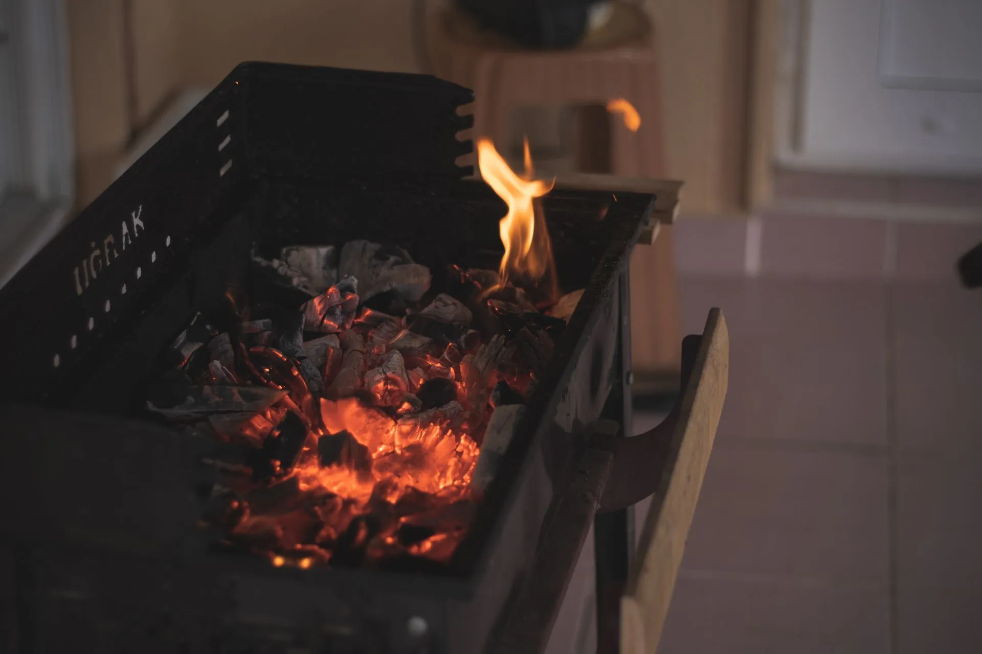 Charcoal being prepared for grilling at YPA Mbuzi Choma