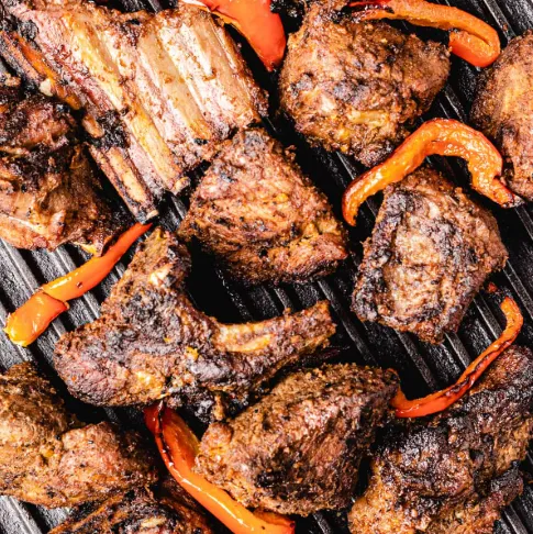 Goat choma being grilled over open charcoal at YPA Mbuzi Choma