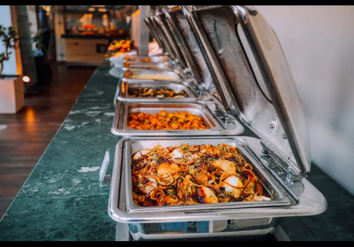 A large buffet spread set up for a wedding or corporate event