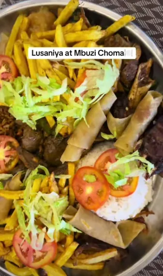 A Lusaniya sharing platter of grilled goat cuts at YPA Mbuzi Choma