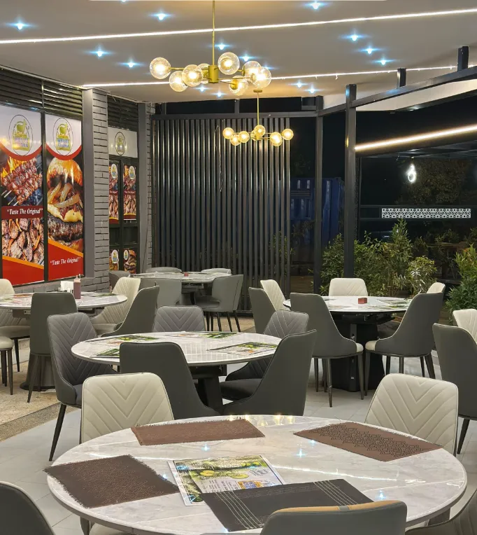 The interior dining space at YPA Mbuzi Choma's Rubaga branch